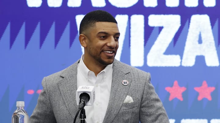 Jan 9, 2026; Washington, District of Columbia, USA; Washington Wizards general manager Will Dawkins (L) introduces newly acquired Wizards guard Trae Young (R) at a press conference prior to the Wizards' game against the New Orleans Pelicans at Capital One Arena. Mandatory Credit: Geoff Burke-Imagn Images
