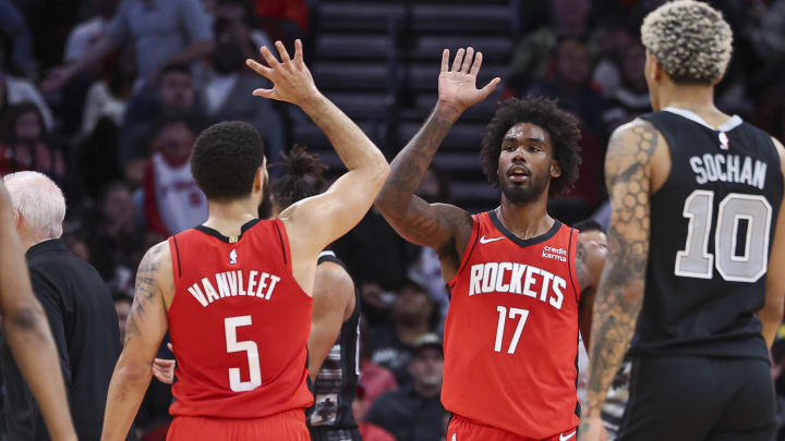 Dec 11, 2023; Houston, Texas, USA; Houston Rockets forward Tari Eason (17) celebrates with guard Fred VanVleet (5) after making a basket during the fourth quarter against the San Antonio Spurs at Toyota Center. Mandatory Credit: Troy Taormina-USA TODAY Sports