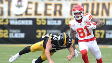 Dec 25, 2024; Pittsburgh, Pennsylvania, USA;  Kansas City Chiefs wide receiver Nikko Remigio (81) returns a punt against Pittsburgh Steelers long snapper Christian Kuntz (46) during the first quarter at Acrisure Stadium. Mandatory Credit: Charles LeClaire-Imagn Images