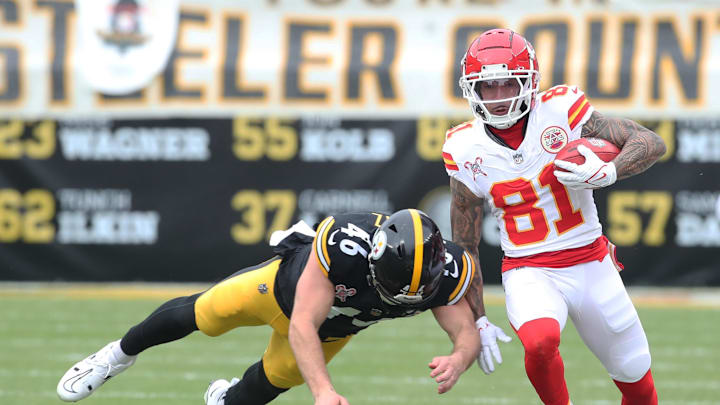 Dec 25, 2024; Pittsburgh, Pennsylvania, USA;  Kansas City Chiefs wide receiver Nikko Remigio (81) returns a punt against Pittsburgh Steelers long snapper Christian Kuntz (46) during the first quarter at Acrisure Stadium. Mandatory Credit: Charles LeClaire-Imagn Images