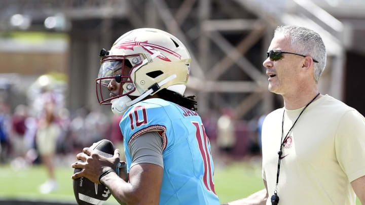 Apr 20, 2024; Tallahassee, Florida, USA; Florida State Seminoles quarterback Trever Jackson (10) and head coach Mike Norvell during the Spring Showcase at Doak S. Campbell Stadium. Mandatory Credit: Melina Myers-USA TODAY Sports