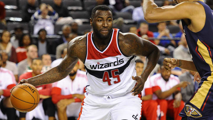 Oct 20, 2014; Baltimore, MD, USA; Washington Wizards center DeJuan Blair (45) dribbles as New Orleans Pelicans center Alexis Ajinca (42) defends during the second half at Baltimore Arena. Mandatory Credit: Brad Mills-USA TODAY Sports
