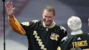 Feb 18, 2024; Pittsburgh, Pennsylvania, USA;  Pittsburgh Penguins former center Mario Lemieux gestures to the crowd during a ceremony to retire the jersey number of Penguins former right wing Jaromir Jagr (not pictured) at PPG Paints Arena. The Penguins host the Los Angeles Kings after the ceremony. Mandatory Credit: Charles LeClaire-Imagn Images