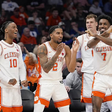 Mar 13, 2025; Charlotte, NC, USA; Clemson Tigers bench applauds a play during the first half against the Southern Methodist Mustangs at Spectrum Center.