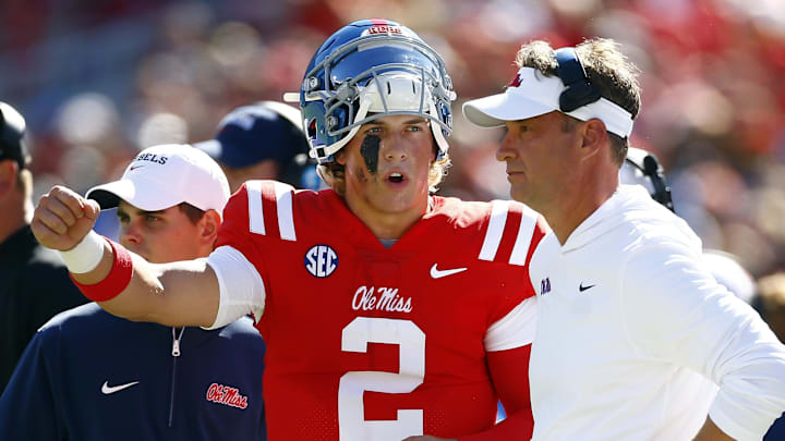 Ole Miss quarterback Jaxson Dart (2) talks with coach Lane Kiffin during the first half against the Middle Tennessee Blue Raiders at Vaught-Hemingway Stadium. 