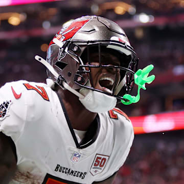 Tampa Bay Buccaneers running back Bucky Irving (7) celebrates after scoring a touchdown against the Atlanta Falcons 