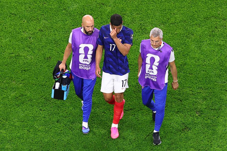 William Saliba getting led from the field.