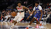 Nov 1, 2025; Washington, District of Columbia, USA; Washington Wizards guard AJ Johnson (4) drives to the basket as Orlando Magic guard Jase Richardson (11) defends in the second half at Capital One Arena. Mandatory Credit: Geoff Burke-Imagn Images