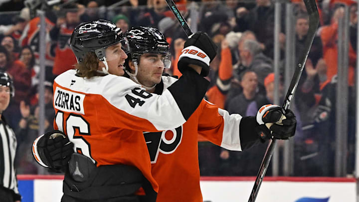 Feb 3, 2026; Philadelphia, Pennsylvania, USA; Philadelphia Flyers defenseman Jamie Drysdale (9) celebrates his goal with center Trevor Zegras (46) against the Washington Capitals during the third period at Xfinity Mobile Arena.