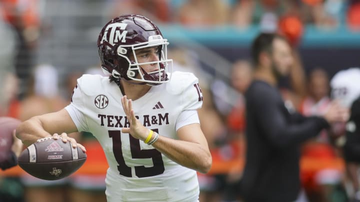 Sep 9, 2023; Miami Gardens, Florida, USA; Texas A&M Aggies quarterback Conner Weigman (15) throws the football during warmups prior to the game against the Miami Hurricanes at Hard Rock Stadium. Mandatory Credit: Sam Navarro-USA TODAY Sports