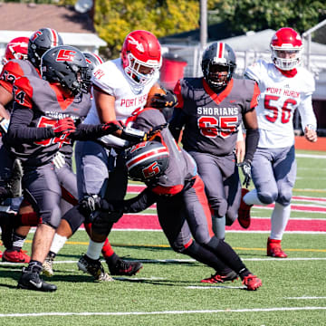 Lake Shore defenders tackle a Port Huron ball carrier in 2020.