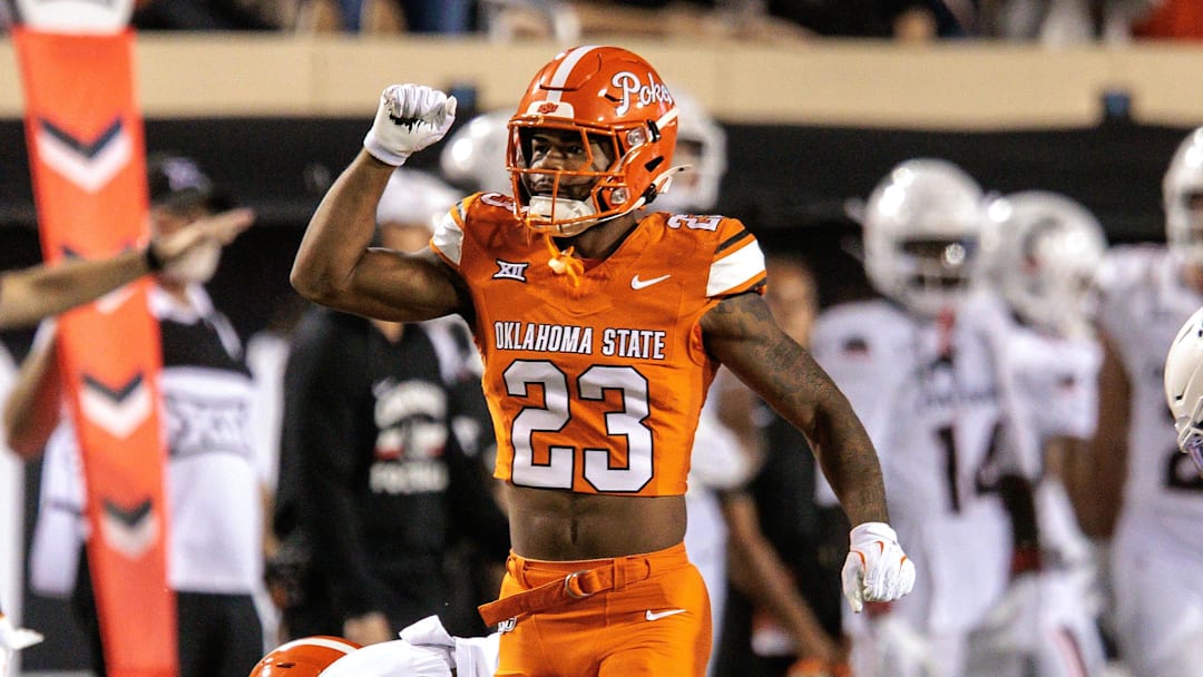 Oct 18, 2025; Stillwater, Oklahoma, USA; Oklahoma State Cowboys safety Kenneth Harris (23) celebrates after a play during the second half against the Cincinnati Bearcats at Boone Pickens Stadium. Mandatory Credit: William Purnell-Imagn Images