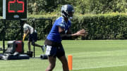 Seattle Seahawks quarterback Geno Smith takes a snap during a drill at training camp.