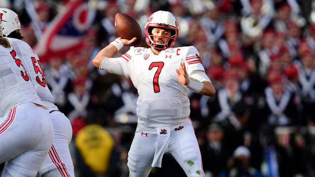 Utah Utes quarterback Cameron Rising attempts a pass during a college football game in the Big 12.