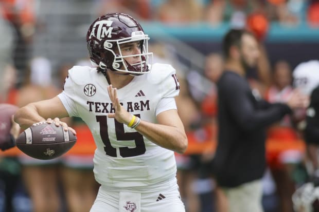 Texas A&M quarterback Conner Weigman throws the football during warmups prior to the game against the Miami Hurricanes.