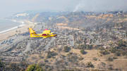 January 9, 2025: Airplanes assist in firefighting above Pacific Palisades. The Palisades Fire ignited earlier and devastated the coastal community in Los Angeles County.