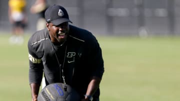 Purdue assistant coach JaMarcus Shephard holds a weighted ball during practice, Friday, Aug. 9, 2019 at Bimel Practice Complex in West Lafayette. 

Purdue Football Training Camp