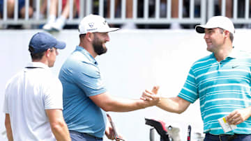 PGA Tour players Rory McIlroy, Jon Rahm and Scottie Scheffler greet each other before teeing off on the first hole during the second round of the FedEx St. Jude Championship at TPC Southwind in Memphis, Tenn., on Friday, August 11, 2023.