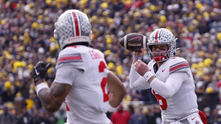 Nov 25, 2023; Ann Arbor, Michigan, USA; Ohio State Buckeyes quarterback Kyle McCord (6) passes to Ohio State Buckeyes wide receiver Emeka Egbuka (2) for a touchdown in the first half against the Michigan Wolverines at Michigan Stadium. Mandatory Credit: Rick Osentoski-USA TODAY Sports