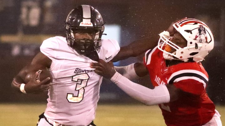 Houston's Ladeadrick James (3) carries the ball as Oakland's Stephen Ellison (2) makes the tackle during the TSSAA BlueCross Bowl Division I Class 6A Championship game at Finley Stadium in Chattanooga, Tenn. on Saturday, Dec. 2, 2023.