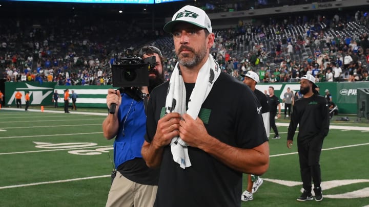 Aug 24, 2024; East Rutherford, New Jersey, USA; New York Jets quarterback Aaron Rodgers (8) walks on the field following the game against the New York Giants at MetLife Stadium.