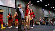 Iowa State Athletic Director Jamie Pollard hands Valero Alamo Bowl CEO Derrick Fox a plane made out of Busch Light cans during the Cyclone Spirit Rally on Thursday, Dec. 27, 2018, in San Antonio. Iowa State takes on Washington State in the Valero Alamo Bowl on Friday.