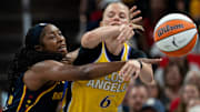 Indiana Fever guard Aari McDonald (2) shoves the ball away from Los Angeles Sparks guard Julie Vanloo (6) during a game Saturday, July 5, 2025, at Gainbridge Fieldhouse in Indianapolis. The Fever fell 87-89 to the Stars.