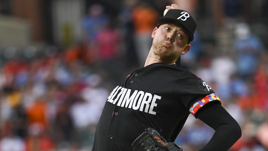 Jun 14, 2024; Baltimore, Maryland, USA; Baltimore Orioles pitcher Kyle Bradish (38) throws a first inning pitch against the Philadelphia Phillies at Oriole Park at Camden Yards. 