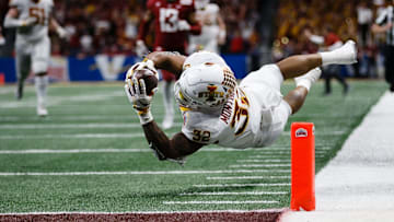 David Montgomery (32) tries to dive into the end zone during the Valero Alamo Bowl. 