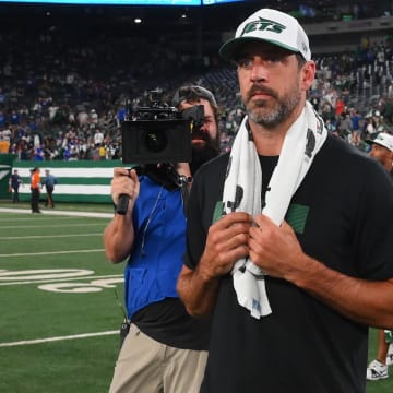 Aug 24, 2024; East Rutherford, New Jersey, USA; New York Jets quarterback Aaron Rodgers (8) walks on the field following the game against the New York Giants at MetLife Stadium.