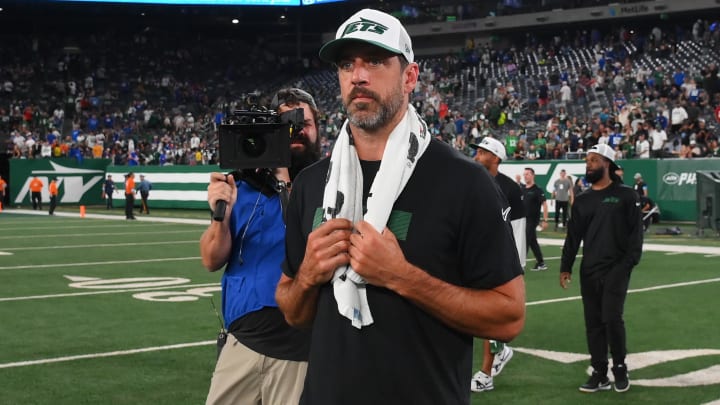 Aug 24, 2024; East Rutherford, New Jersey, USA; New York Jets quarterback Aaron Rodgers (8) walks on the field following the game against the New York Giants at MetLife Stadium.