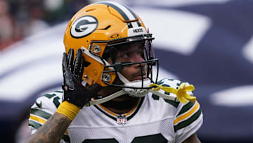 Nov 17, 2024; Chicago, Illinois, USA; Former Green Bay Packers cornerback Jaire Alexander (23) gestures to the fans before the game against the Chicago Bears at Soldier Field.