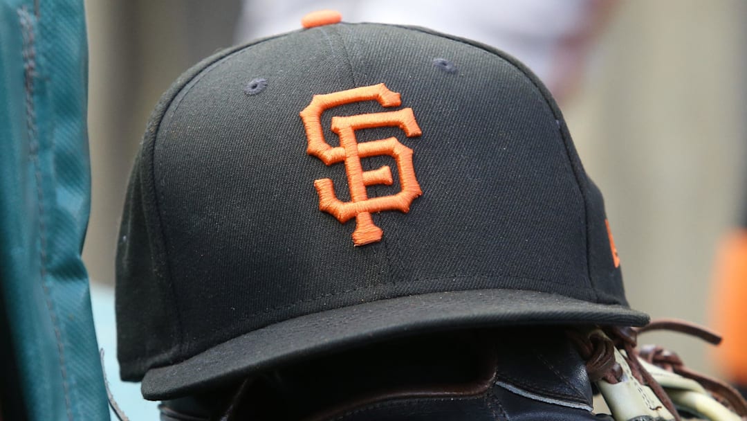 Jul 14, 2023; Pittsburgh, Pennsylvania, USA;  San Francisco Giants hat and glove on the bench against the Pittsburgh Pirates during the first inning at PNC Park. 