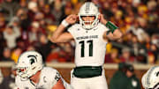 Nov 1, 2025; Minneapolis, Minnesota, USA; Michigan State Spartans quarterback Alessio Milivojevic (11) calls a play against the Minnesota Golden Gophers during the second half at Huntington Bank Stadium. Mandatory Credit: Matt Krohn-Imagn Images
