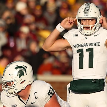 Nov 1, 2025; Minneapolis, Minnesota, USA; Michigan State Spartans quarterback Alessio Milivojevic (11) calls a play against the Minnesota Golden Gophers during the second half at Huntington Bank Stadium. Mandatory Credit: Matt Krohn-Imagn Images