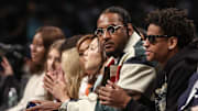 Oct 1, 2024; Brooklyn, New York, USA;  Former NBA forward Carmelo Anthony and his son Kyian Anthony during game two of the 2024 WNBA Semi-finals at Barclays Center. Mandatory Credit: Wendell Cruz-Imagn Images