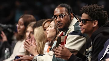 Oct 1, 2024; Brooklyn, New York, USA;  Former NBA forward Carmelo Anthony and his son Kyian Anthony during game two of the 2024 WNBA Semi-finals at Barclays Center. Mandatory Credit: Wendell Cruz-Imagn Images