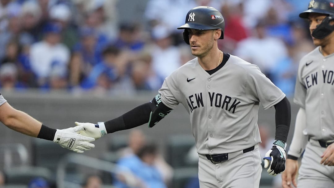 Oct 5, 2025; Toronto, Ontario, CAN; New York Yankees Cody Bellinger (35) is congratulated after hitting a two-run home run in the sixth inning against the Toronto Blue Jays during game two of the ALDS round for the 2025 MLB playoffs at Rogers Centre. Mandatory Credit: John E. Sokolowski-Imagn Images