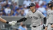 Oct 5, 2025; Toronto, Ontario, CAN; New York Yankees Cody Bellinger (35) is congratulated after hitting a two-run home run in the sixth inning against the Toronto Blue Jays during game two of the ALDS round for the 2025 MLB playoffs at Rogers Centre. Mandatory Credit: John E. Sokolowski-Imagn Images