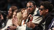 Oct 1, 2024; Brooklyn, New York, USA;  Former NBA forward Carmelo Anthony and his son Kyian Anthony during game two of the 2024 WNBA Semi-finals at Barclays Center. Mandatory Credit: Wendell Cruz-Imagn Images