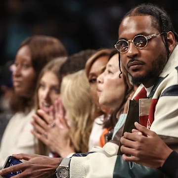 Oct 1, 2024; Brooklyn, New York, USA;  Former NBA forward Carmelo Anthony and his son Kyian Anthony during game two of the 2024 WNBA Semi-finals at Barclays Center. Mandatory Credit: Wendell Cruz-Imagn Images