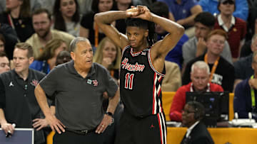 Apr 5, 2025; San Antonio, TX, USA; Houston Cougars head coach Kelvin Sampson talks with forward Joseph Tugler (11).