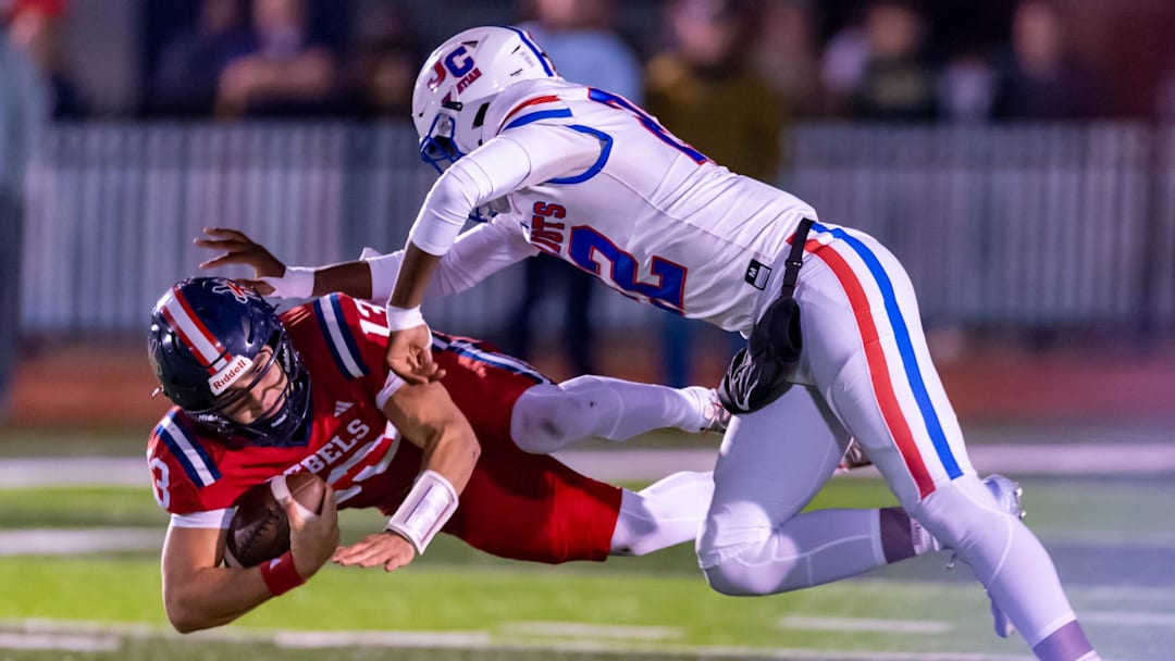 A John Curtis defender makes the tackle on Teurlings Catholic QB Alex Munoz A John Curtis defender makes the tackle on Teurlings Catholic QB Alex Munoz