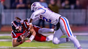 A John Curtis defender makes the tackle on Teurlings Catholic QB Alex Munoz