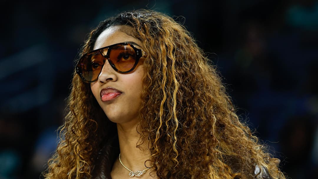 Chicago Sky forward Angel Reese stands on the sidelines before a WNBA game against the New York Liberty. Chicago Sky forward Angel Reese stands on the sidelines before a WNBA game against the New York Liberty.