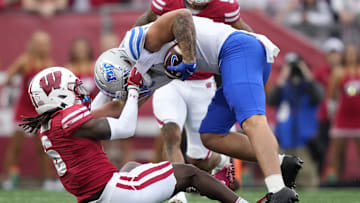 Omillio Agard, Wisconsin Badgers, Hunter Tipton, Middle Tennessee Blue Raiders. (Mandatory Credit: Kayla Wolf-Imagn Images)