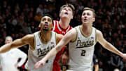 Purdue forward Trey Kaufman-Renn (4) and guard Fletcher Loyer (2) box out Wisconsin forward Nolan Winter (31)