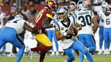 Oct 20, 2024; Landover, Maryland, USA; Carolina Panthers quarterback Bryce Young (9) scrambles against the Washington Commanders during the fourth quarter at Northwest Stadium. Mandatory Credit: Geoff Burke-Imagn Images