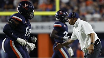 Sep 14, 2024; Charlottesville, Virginia, USA; Virginia Cavaliers head coach Tony Elliott encourages his team during a change of possession against the Maryland Terrapins during the first half at Scott Stadium. Mandatory Credit: Geoff Burke-Imagn Images