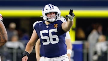 Dallas Cowboys center Cooper Beebe signals at the line against the New York Giants.